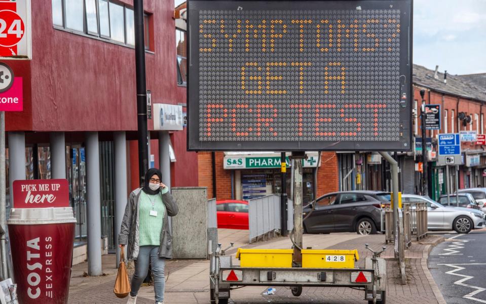 Covid information signs on a main road in Bolton, May 2021 - Paul Cooper