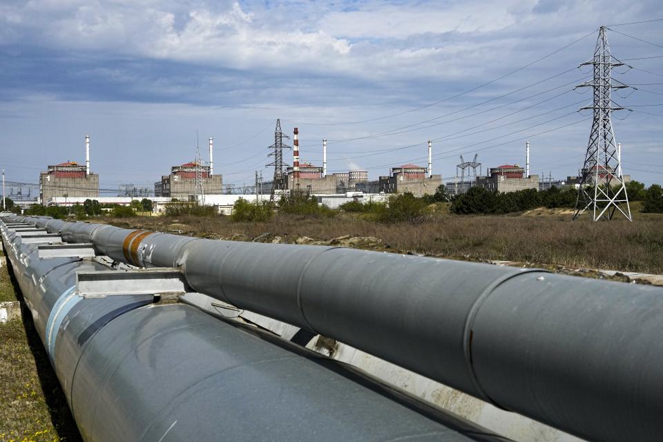 FILE - A view of the Zaporizhzhia Nuclear Power Station, in Enerhodar, Zaporizhzhia region, in territory under Russian military control, southeastern Ukraine, on May 1, 2022. An external power line to Ukraine's Zaporizhzhia nuclear power plant — the biggest in Europe — was repaired on Sunday Oct. 9, 2022 after shelling disconnected the facility from the grid and forced it to resort to emergency diesel generators, the U.N. nuclear watchdog said. (AP Photo, File)