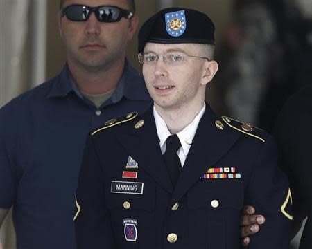 U.S. Army Private First Class Bradley Manning (C) departs the courthouse at Fort Meade, Maryland July 30, 2013. REUTERS/Gary Cameron