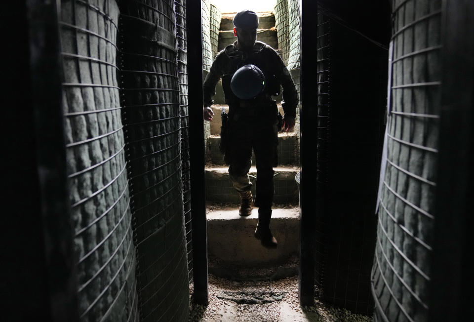 A Spanish U.N. peacekeeper enters a shelter at a base in Abbassiyeh, a Lebanese border village with Israel, on Wednesday, Jan. 10, 2024. The prospect of a full-scale war between Israel and Lebanon’s Hezbollah militia terrifies people on both sides of the border, but some see it as an inevitable fallout from Israel’s ongoing war against Hamas in Gaza. (AP Photo/Hussein Malla)