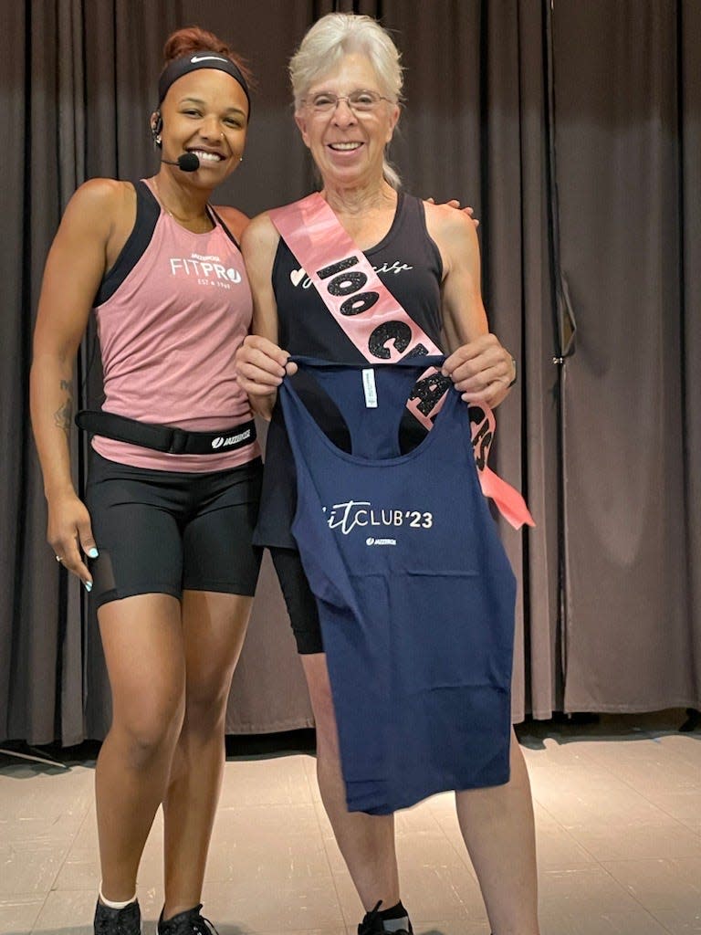 From left, Melissa Stukes, instructor at Jazzercize Poughkeepsie and Karen Schoonmaker, member at Jazzercize Poughkeepsie being recognized for participating in 100 classes.