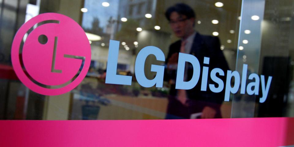 FILE PHOTO: A man walks out of the headquarters of LG Display in Seoul, October 20, 2011.  REUTERS/Jo Yong-Hak/File Photo    