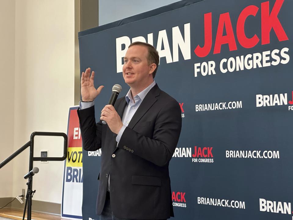 Republican Brian Jack speaks to a crowd at a rally in Newnan, Ga. on Monday, June 10, 2024. A former Donald Trump aide, Jack is seeking the GOP nomination in the June 18, 2024 runoff against former state Senate Minority Leader Mike Dugan. (AP Photo/Jeff Amy)