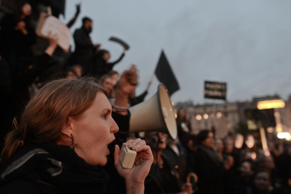 Men and women chanting in Krakow's main square.