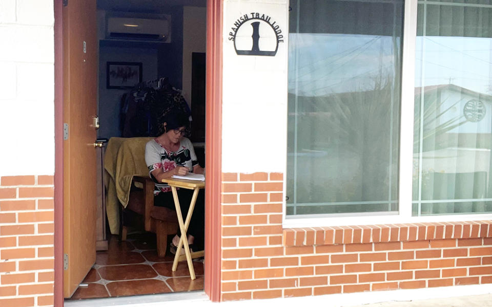 Fort Stockton teacher Staci Ely works in her room at the Spanish Trail Lodge. (Courtesy of Staci Ely)