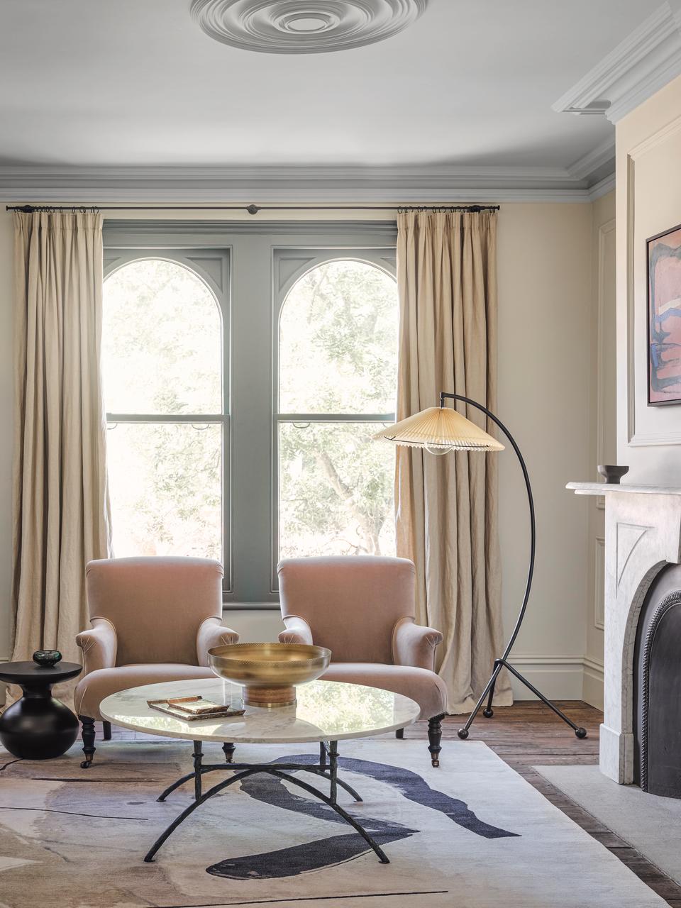 Nautral living room with long beige curtains