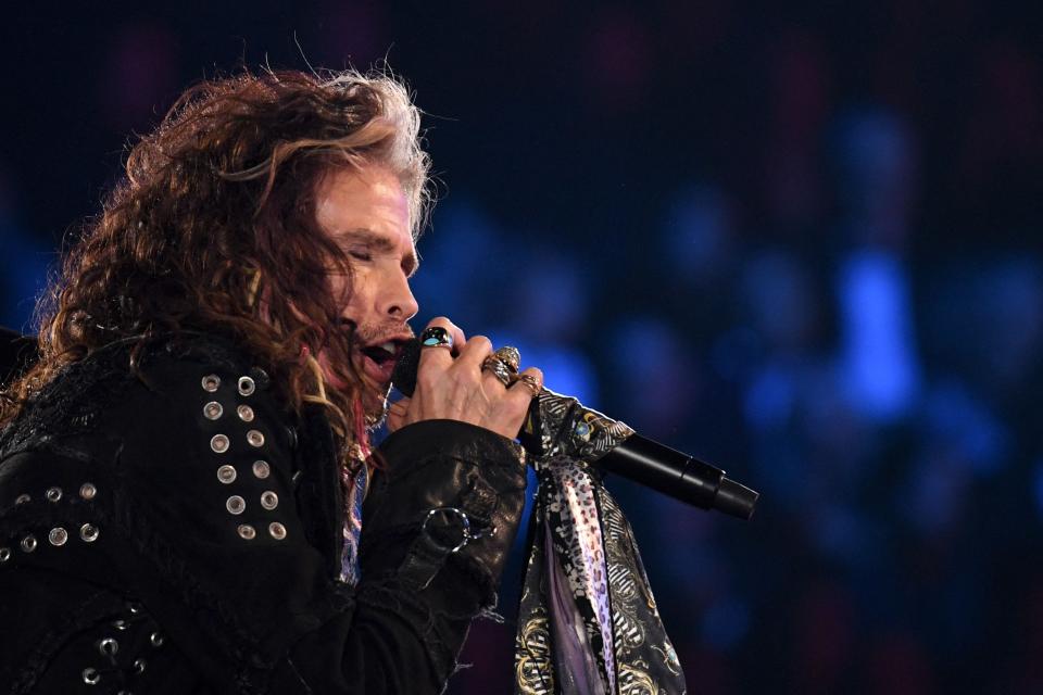 (FILES) In this file photo taken on January 26, 2020, US singer-songwriter Steven Tyler of Aerosmith performs during the 62nd Annual Grammy Awards in Los Angeles. - Aerosmith frontman Steven Tyler is facing a lawsuit by a woman who claims he sexually assaulted her as a minor during a years-long relationship in the 1970s. Claimant Julia Holcomb, who is now 65, alleges "American Idol" judge Tyler was granted guardianship of her when she was 16, which he used to engage in a sexual relationship. (Photo by Robyn Beck / AFP) (Photo by ROBYN BECK/AFP via Getty Images) ORIG FILE ID: AFP_336A96E.jpg