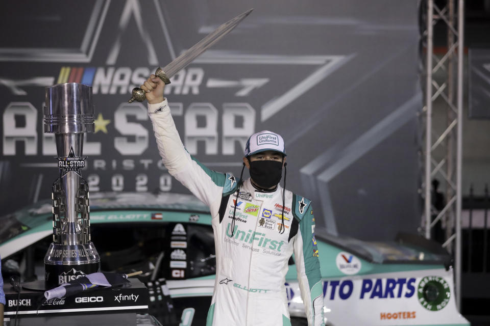 Chase Elliott celebrates with the trophy after winning a NASCAR All-Star auto race at Bristol Motor Speedway in Bristol, Tenn, Wednesday, July 15, 2020. (AP Photo/Mark Humphrey)