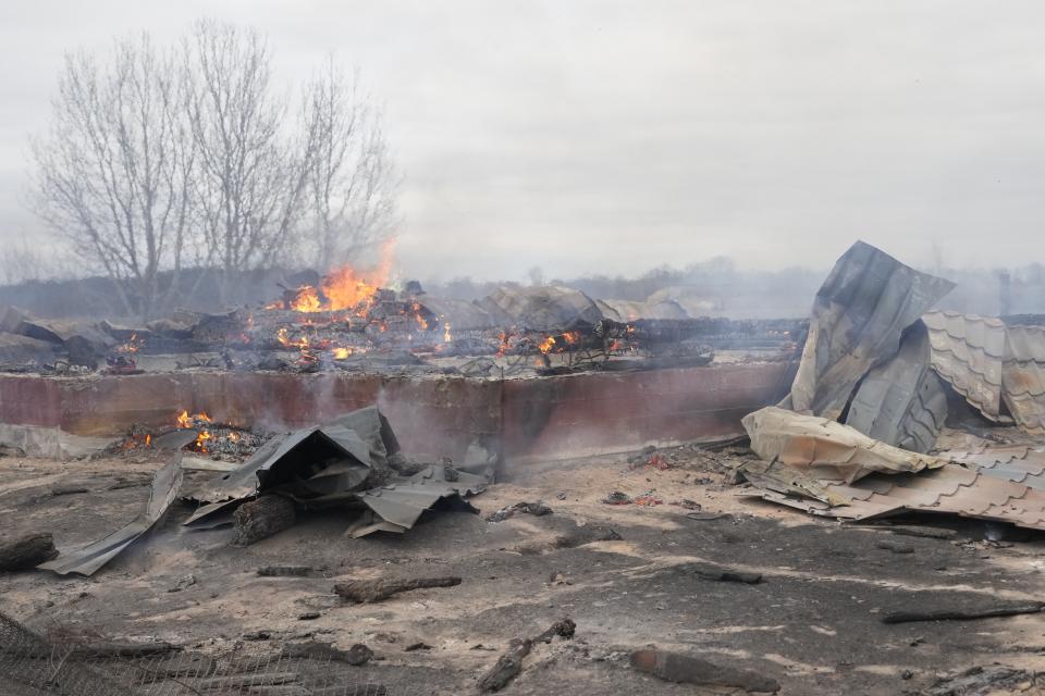 <p>Smoke and flame rise from the debris of a privet house in the aftermath of Russian shelling outside Kyiv, Ukraine, Thursday, Feb. 24, 2022. Russia on Thursday unleashed a barrage of air and missile strikes on Ukrainian facilities across the country. (AP Photo/Efrem Lukatsky)</p> 