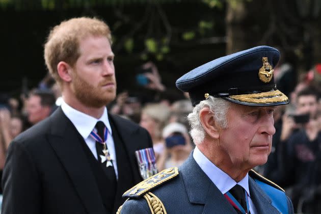 King Charles III and Prince Harry walk behind the coffin of Queen Elizabeth II during a procession in London on Sep. 14, 2022. 