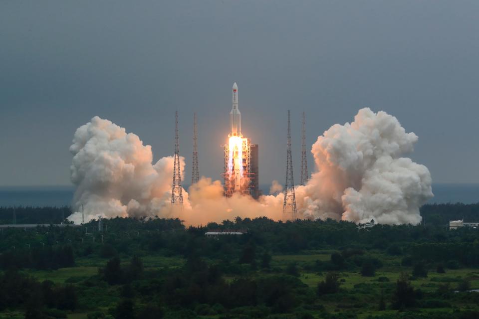 In this April 29, 2021, file photo released by China's Xinhua News Agency, a Long March 5B rocket carrying a module for a Chinese space station lifts off from the Wenchang Spacecraft Launch Site in Wenchang in southern China's Hainan Province. The central rocket segment that launched the 22.5-ton core of China's newest space station into orbit is due to plunge back to Earth as early as Saturday in an unknown location.