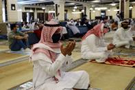 A Saudi man wearing a protective face mask performs the Friday prayers inside the Al-Rajhi Mosque, after the announcement of the easing of lockdown measures amid the coronavirus disease (COVID-19) outbreak, in Riyadh