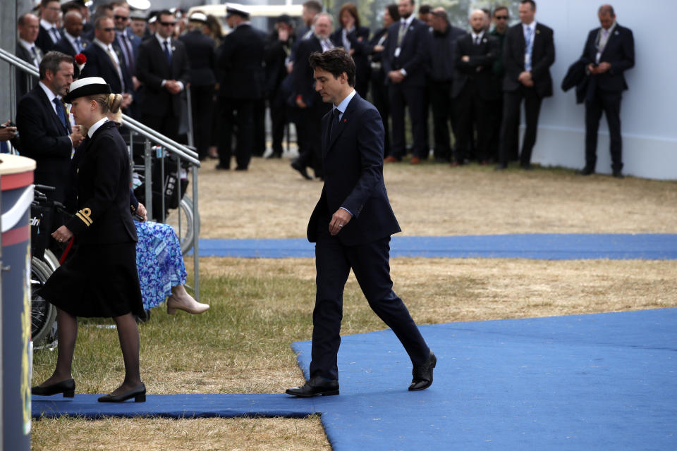 Canadian Prime Minister Justin Trudeau walks to his seat after speaking as he takes part in the D-Day 75th Anniversary British International Commemorative Event at Southsea Common in Portsmouth, England, on Wednesday, June 5, 2019. (AP Photo/Alex Brandon)
