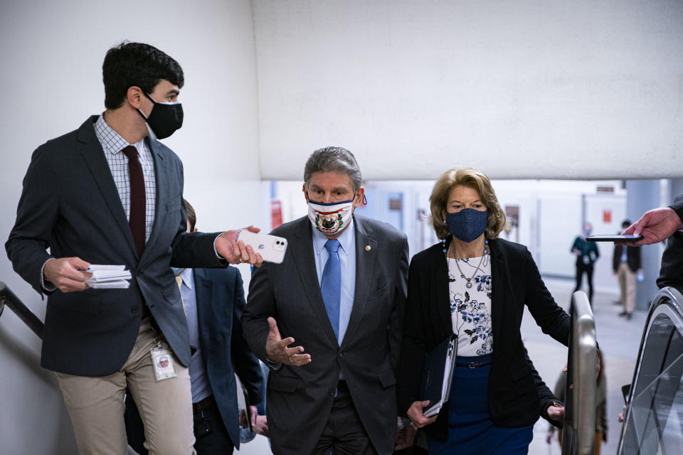 WASHINGTON, DC - FEBRUARY 23: Sen. Joe Manchin (D-WV) and Sen. Lisa Murkowski (R-AK) speak as they arrive to vote in the U.S. Capitol on February 23, 2021 in Washington, DC. The Senate held confirmation hearings today for multiple Biden administration nominees as well as a hearing regarding the January 6 attack on the U.S. Capitol.  (Photo by Al Drago/Getty Images)