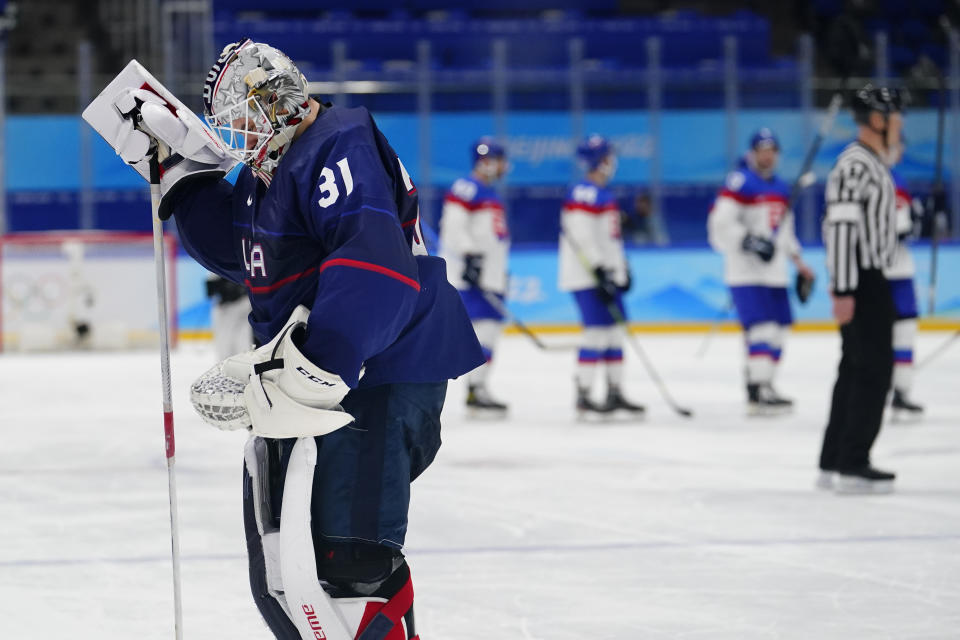 United States goalkeeper Strauss Mann (31) leaves the ice after the United States lost to Slovakia in a men's quarterfinal hockey game at the 2022 Winter Olympics, Wednesday, Feb. 16, 2022, in Beijing. Slovakia won 3-2 in a shoot-out. (AP Photo/Matt Slocum)