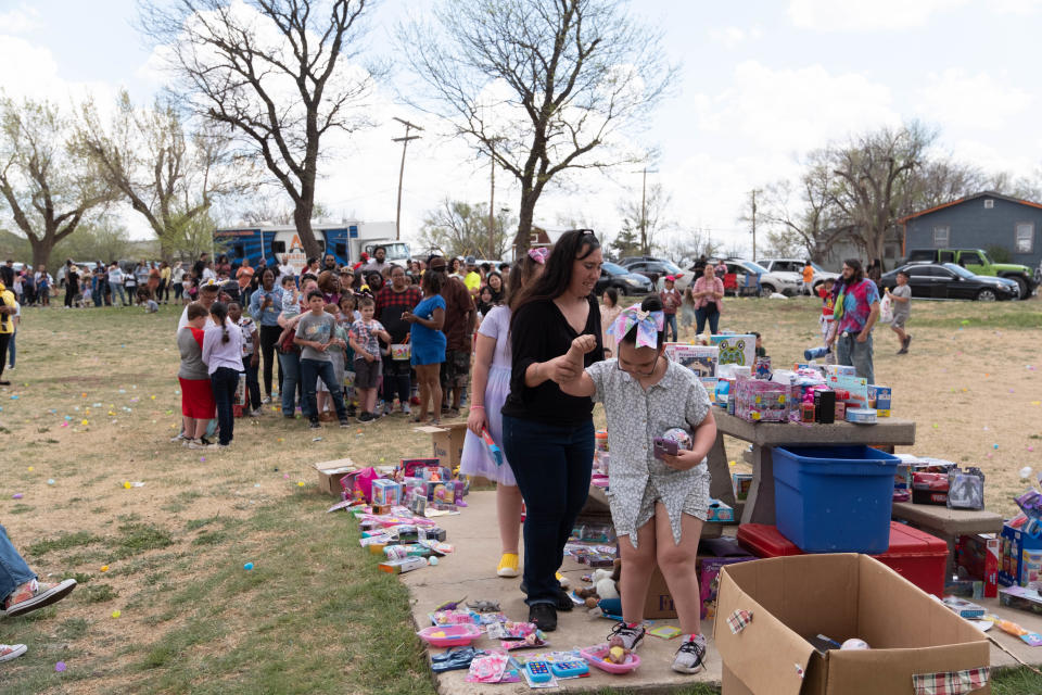 Families line up to collect toy prizes at Shi Lee's 7th annual Citywide Easter Egg Hunt  Sunday at Bones Hooks Park in Amarillo.