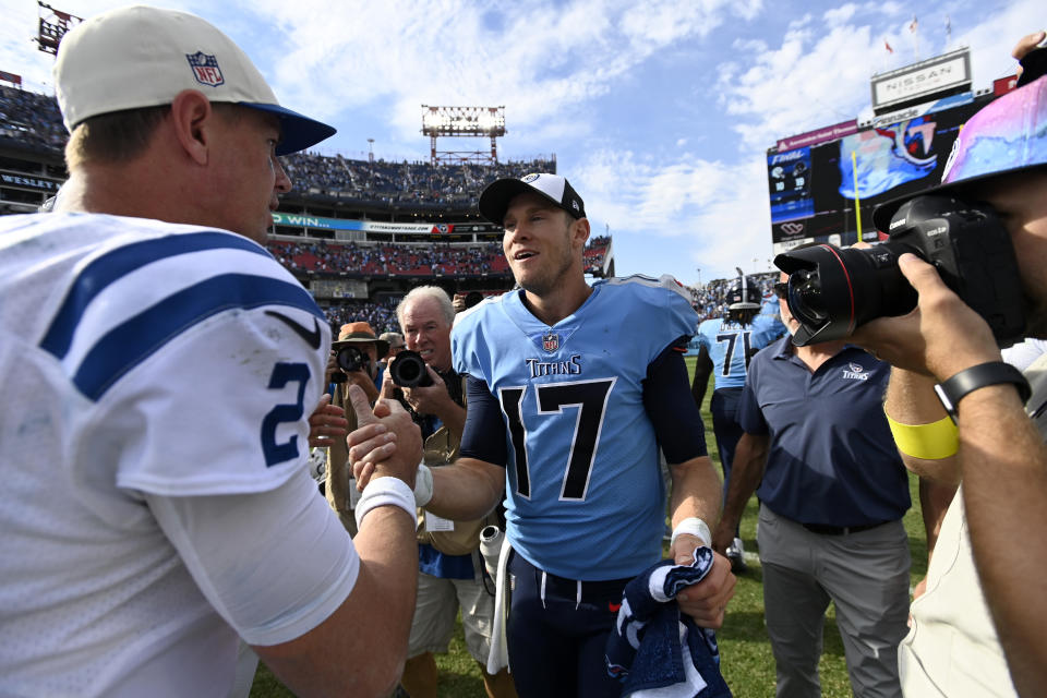 Tennessee Titans quarterback Ryan Tannehill (17) and Indianapolis Colts quarterback Matt Ryan (2) shake hands following an NFL football game Sunday, Oct. 23, 2022, in Nashville, Tenn. The Titans won 19-10. (AP Photo/Mark Zaleski)