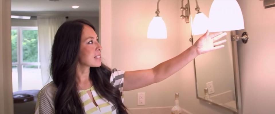 Joanna Gaines shows off salvaged light fixtures.