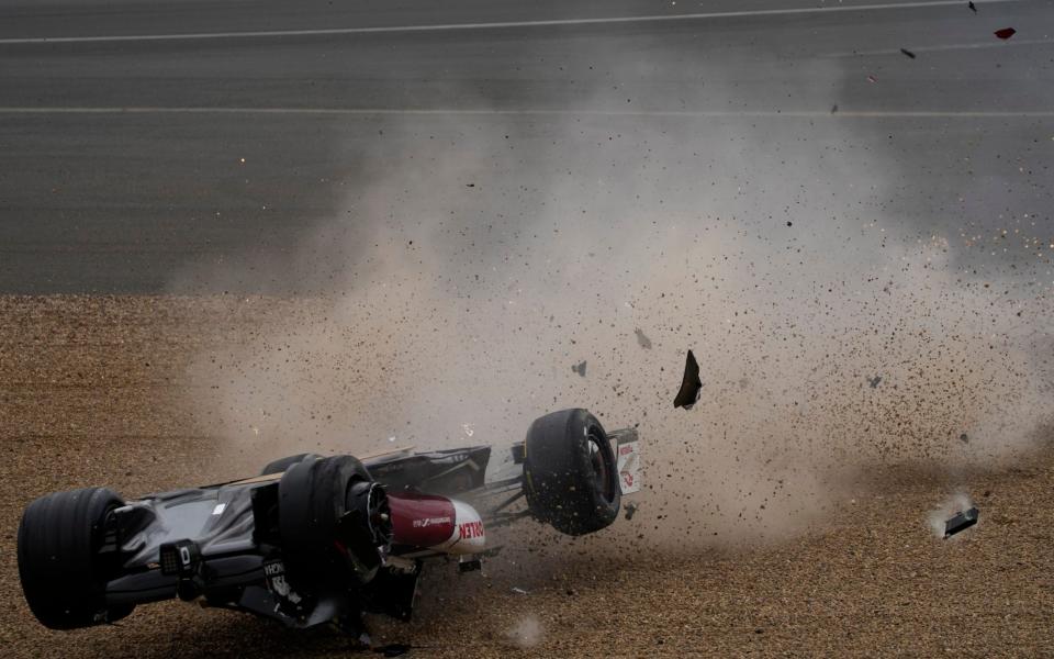 Alfa Romeo driver Guanyu Zhou of China crashes at the start of the British Formula One Grand Prix at the Silverstone circuit, in Silverstone, England, Sunday, July 3, 2022 - AP