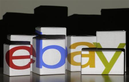 An eBay logo is projected onto white boxes in this illustration picture taken in Warsaw, January 21, 2014. REUTEwhite RS/Kacper Pempel