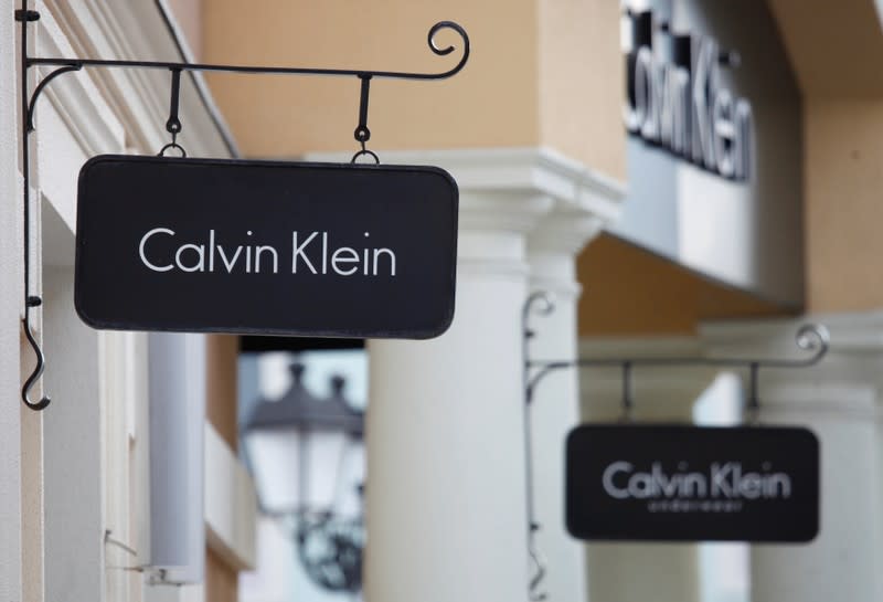 Boards with Calvin Klein store logo are seen on a shopping center at the outlet village Belaya Dacha outside Moscow