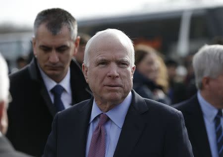 U.S. Senator John McCain arrives on a visit at a migrant center near the village of Adasevci, Serbia February 12, 2016. REUTERS/Marko Djurica/File Photo