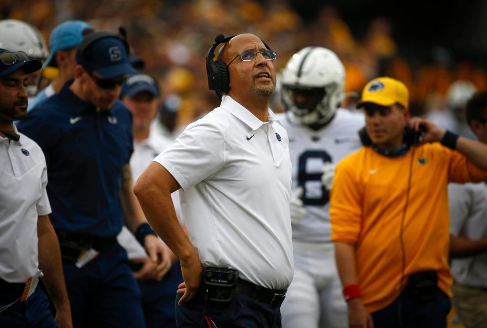 Penn State head football coach James Franklin looks up at the big screen after a play in the third quarter against Iowa.