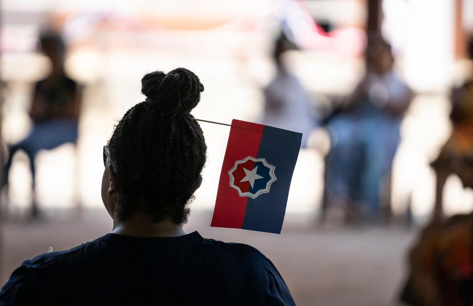 Jun 18, 2023; Columbus, OH, USA; Kim Avery wears a Juneteenth flag in her hair during the Juneteenth Jubilee Day Festival in the Ohio Village on the grounds of the Ohio History Center. 