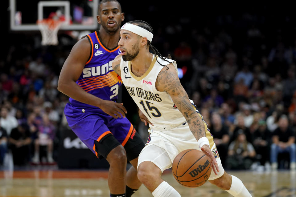 New Orleans Pelicans guard Jose Alvarado (15) drives past Phoenix Suns guard Chris Paul (3) during the first half of an NBA basketball game, Friday, Oct. 28, 2022, in Phoenix. (AP Photo/Matt York)