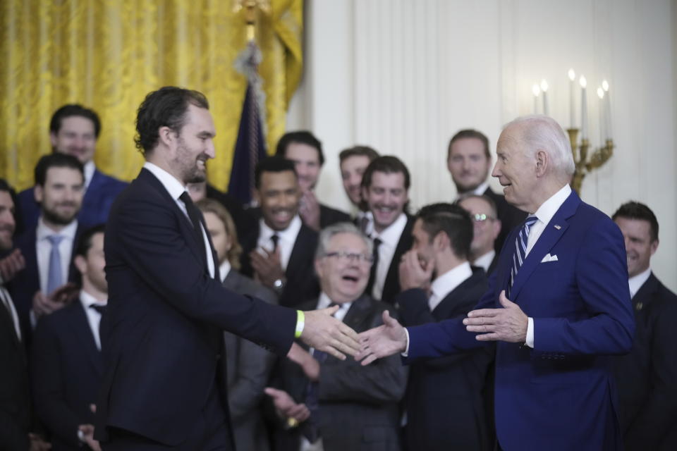 President Joe Biden greets team captain Mark Stone during an event to celebrate the Vegas Golden Knights in their 2023 Stanley Cup victory in the East Room of the White House, Monday, Nov. 13, 2023, in Washington. (AP Photo/Andrew Harnik)