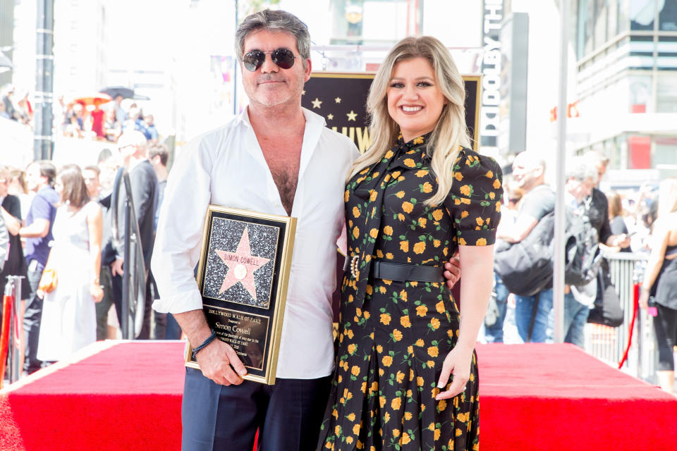 Kelly Clarkson helped honor Simon Cowell at his Hollywood Walk of Fame ceremony on Aug. 22, 2018. (Photo: Rich Fury/Getty Images)