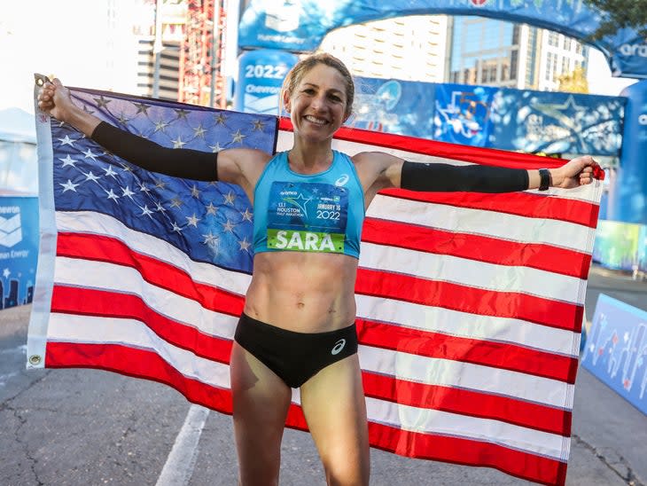 Sara Hall holds an American flag at the Houston Half Marathon where she set the American record