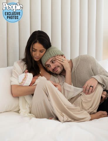 <p>Hannah Cree Photography</p> Michael Clifford and wife Crystal gazing at daughter Lua