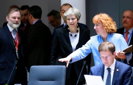 Britain's Prime Minister Theresa May and Slovenia's Prime Minister Miro Cerar attend a European Union leaders summit in Brussels, Belgium, March 23, 2018. Olivier Hoslet/Pool via Reuters