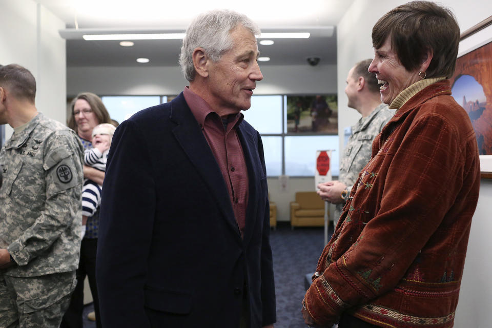 U.S. Secretary of Defense Chuck Hagel talks with retired Army Col. Rebecca Hooper, program manager for the Center for the Intrepid, after Hagel spoke to soldiers, veterans and staff at the center in San Antonio on Wednesday, Jan. 8, 2014. (AP Photo/The San Antonio Express-News, Lisa Krantz) RUMBO DE SAN ANTONIO OUT; NO SALES