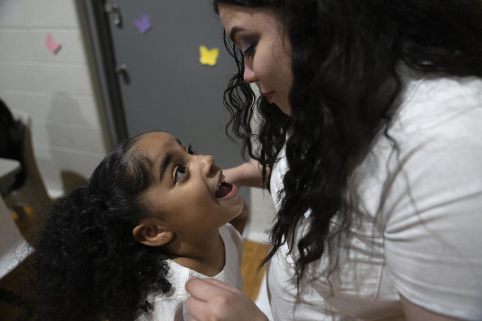 6-year-old Myla Martinez enthusiastically greets her mother Crystal Martinez as she and her four siblings spend time with her during a special visit at Logan Correctional Center, Saturday, May 20, 2023, in Lincoln, Ill. (AP Photo/Erin Hooley)