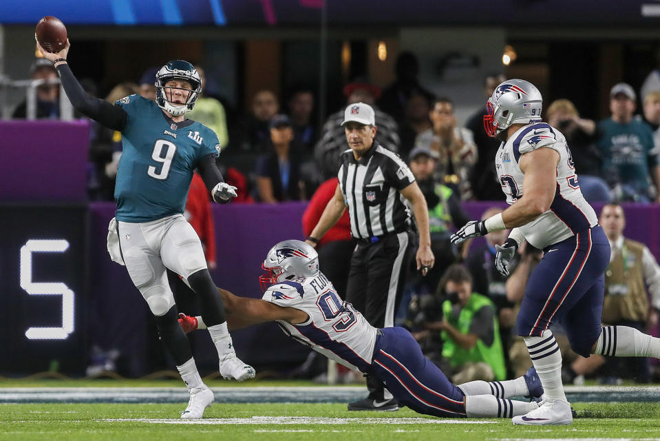 <p>Philadelphia Eagles’ Nick Foles (9) is pressured by New England Patriots’ Trey Flowers during the first half of the NFL Super Bowl 52 football game Sunday, Feb. 4, 2018, in Minneapolis. (AP Photo/Jeff Roberson) </p>