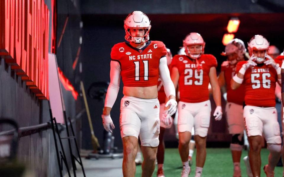 N.C. State linebacker Payton Wilson (11) heads down the tunnel to warm up before N.C. State’s game against UNC at Carter-Finley Stadium in Raleigh, N.C., Saturday, Nov. 25, 2023.