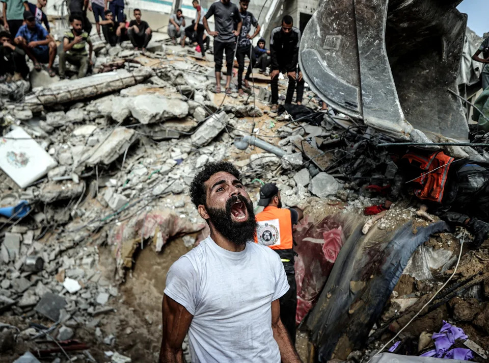 A man yells during a search for survivors following an Israeli airstrike in Gaza City in October.