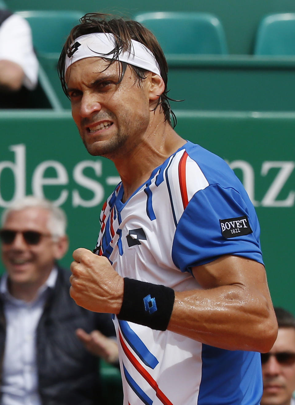 David Ferrer of Spain reacts after making a point against Rafael Nadal of Spain during their quarterfinals match of the Monte Carlo Tennis Masters tournament in Monaco, Friday, April 18, 2014. Ferrer won 7-6 6-4. (AP Photo/Michel Euler)