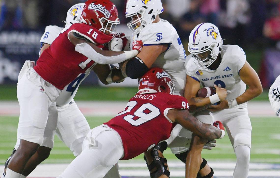 Fresno State’s.David Perales, #99, is on the sack of San Jose State quarterback Chevan Cordeiro in first half action Saturday, Oct. 15, 2022 in Fresno.