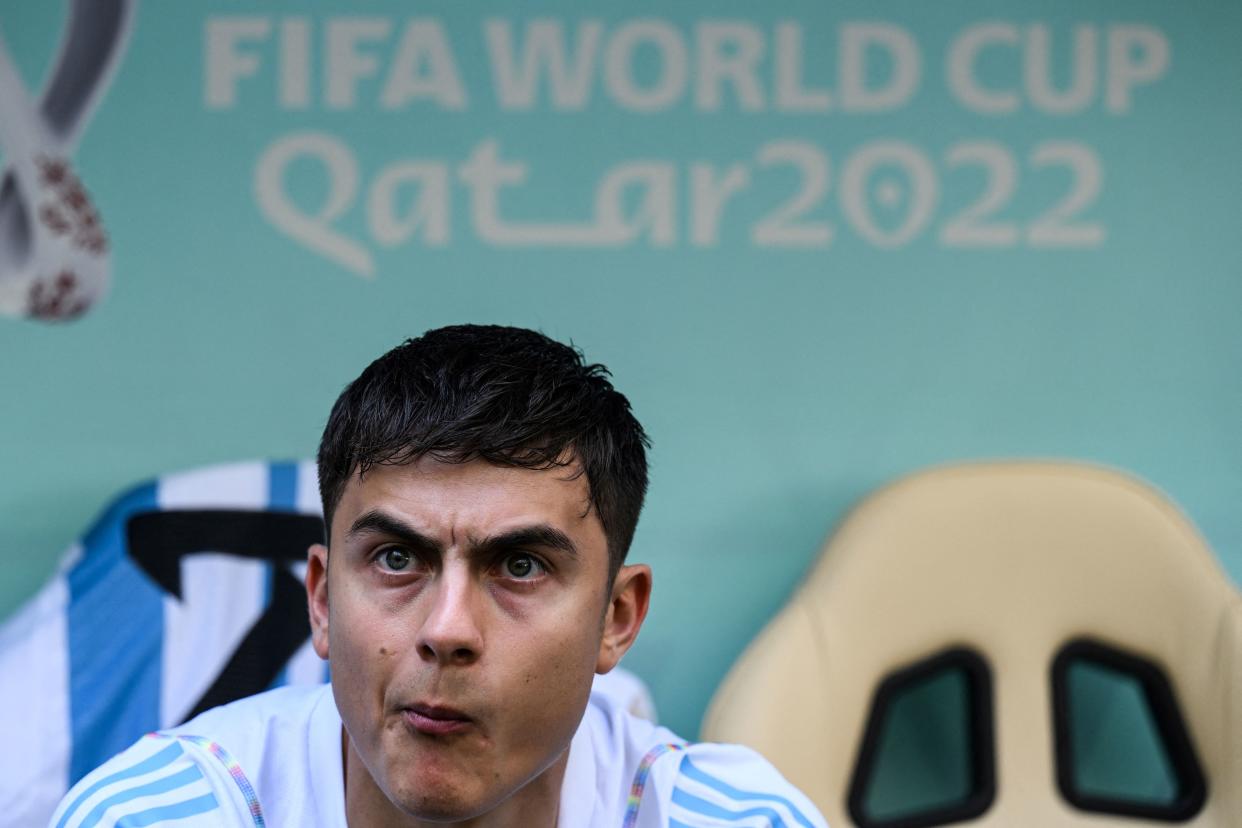 Argentina's forward #21 Paulo Dybala looks on from the pitch side during the Qatar 2022 World Cup Group C football match between Argentina and Saudi Arabia at the Lusail Stadium in Lusail, north of Doha on November 22, 2022. (Photo by Kirill KUDRYAVTSEV / AFP) (Photo by KIRILL KUDRYAVTSEV/AFP via Getty Images)