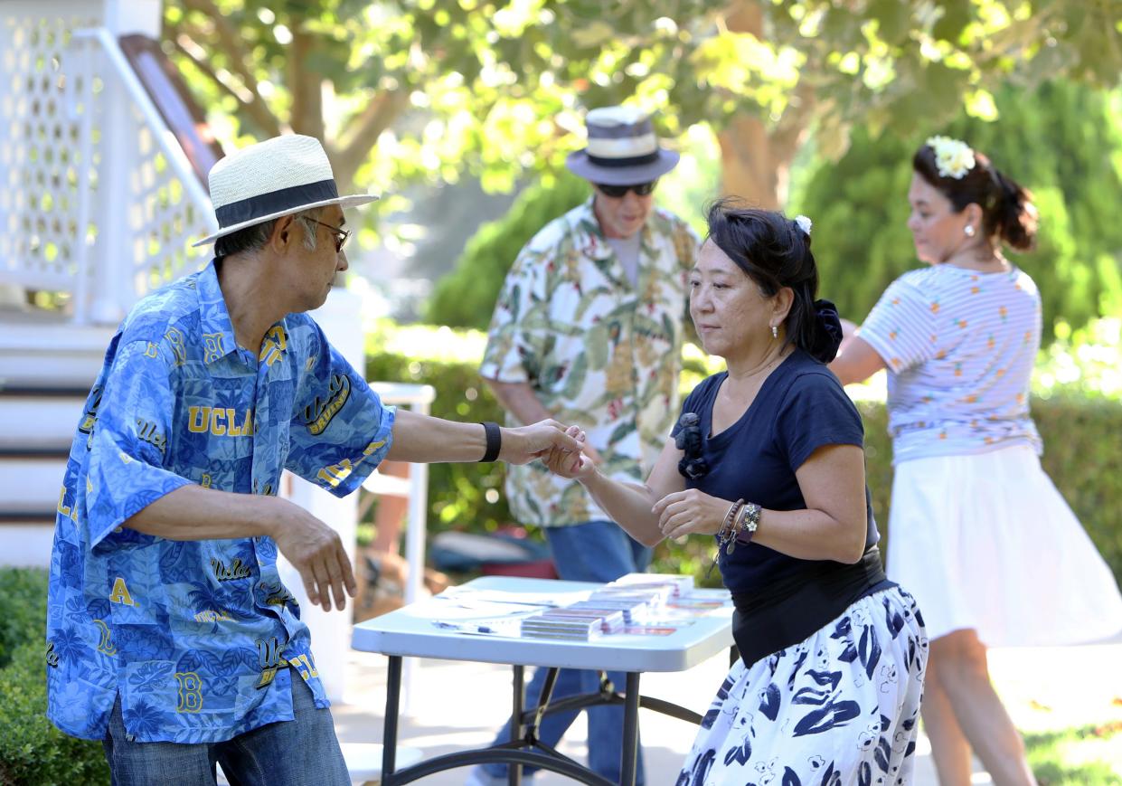 Alex Vasallo and Joyce Yamamoto, both from South Bay, and Bill and Teresa Dakin, of Thousand Oaks, dance during the 16th annual Summer Jazz Concert at the Gardens of the World in Thousand Oaks in 2018.