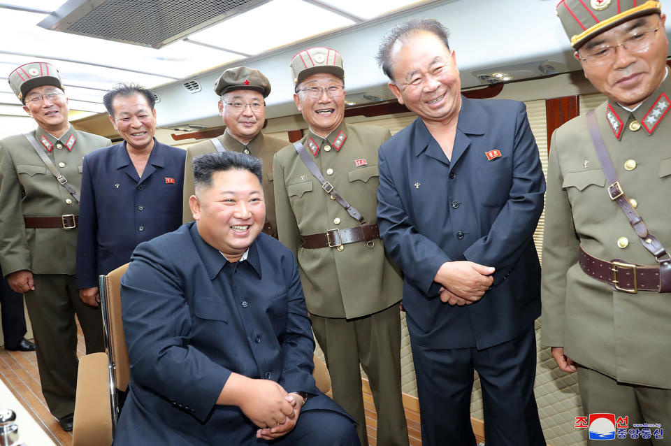 In this Saturday, Aug. 10, 2019, photo provided by the North Korean government, North Korean leader Kim Jong Un, sitting, watches test firings of short-range weapons at an undisclosed location in North Korea. North Korea on Saturday extended a recent streak of weapons displays by firing what appeared to be two short-range ballistic missiles into the sea, according to South Korea's military. The content of this image is as provided and cannot be independently verified. Korean language watermark on image as provided by source reads: "KCNA" which is the abbreviation for Korean Central News Agency. (Korean Central News Agency/Korea News Service via AP)