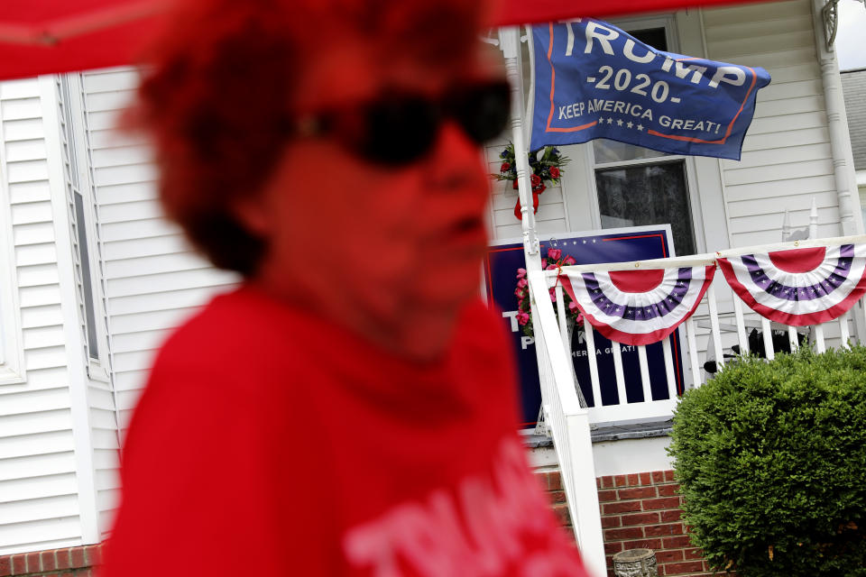 Doris Miller 86, tends to her makeshift store selling Trump souvenirs in front of her home, Sunday, Aug. 2, 2020, in Vienna, Ill. This is a deeply conservative part of the nation _ 77 percent of the county voted for President Donald Trump in the 2016 elections; just 19 percent went for Hillary Clinton. (AP Photo/Wong Maye-E)