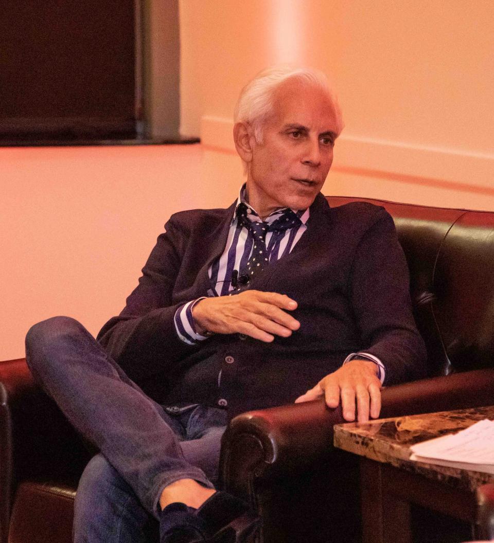 Photographer Steven Caras answers questions during the opening of "Carasmatic," a photography exhibit at the Kravis Center that features images from his personal archive.