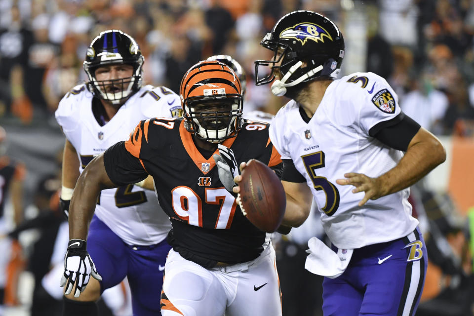 FILE - In this Sept. 13, 2018, file photo, Cincinnati Bengals defensive tackle Geno Atkins (97) pursues Baltimore Ravens quarterback Joe Flacco (5) before completing the sack during the first half of an NFL football game in Cincinnati. Atkins has looked super, getting three sacks and plenty of pressures. (AP Photo/Bryan Woolston, File)