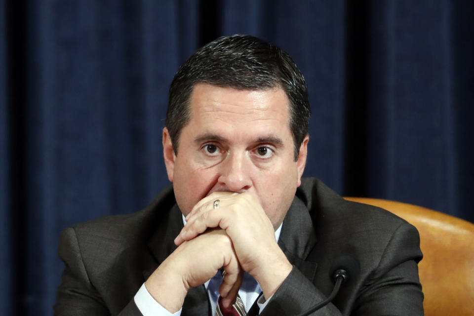 Ranking member Rep. Devin Nunes of Calif., listens as Ambassador Kurt Volker, former special envoy to Ukraine, and Tim Morrison, a former official at the National Security Council, testify before the House Intelligence Committee on Capitol Hill in Washington, Tuesday, Nov. 19, 2019, during a public impeachment hearing of President Donald Trump's efforts to tie U.S. aid for Ukraine to investigations of his political opponents. (AP Photo/Jacquelyn Martin, Pool)