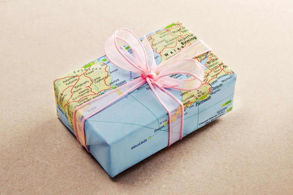 Gifts wrapped in a travel-themed wrapping paper