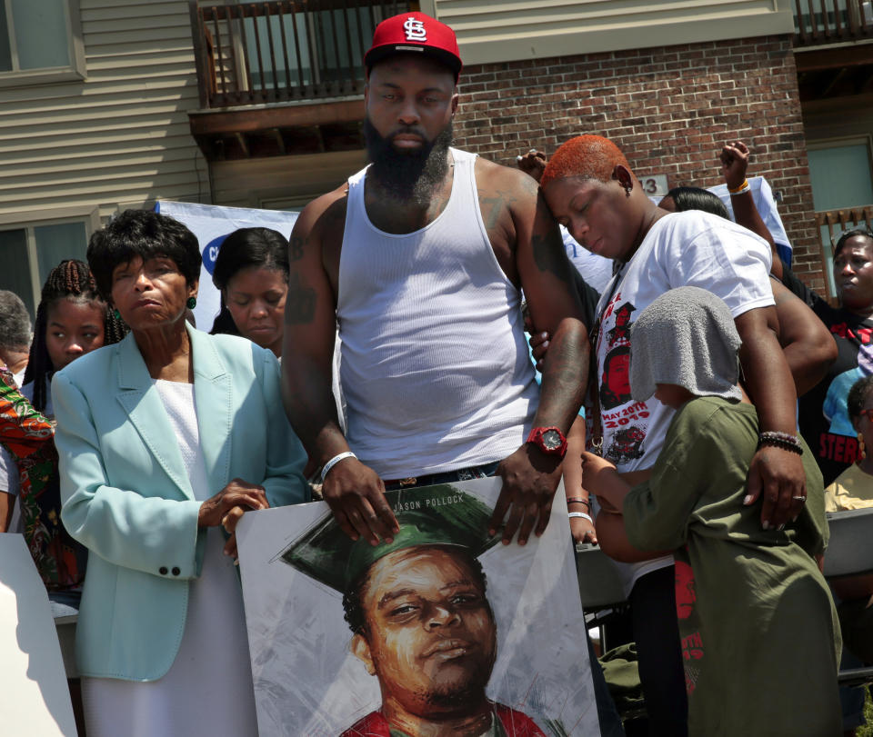 FILE - In this Aug. 9, 2019, file photo, Cal Brown stands with her husband Michael Brown Sr. during a memorial program for Michael Brown Jr., fatally shot by a police officer, in Ferguson, Mo. A wave of police killings of young black men in 2014 prompted 24 states to quickly pass some type of law enforcement reform, but many declined to address the most glaring issue: police use of force. Six years later, only about a third of states have passed laws on the question. (Robert Cohen/St. Louis Post-Dispatch via AP, File)